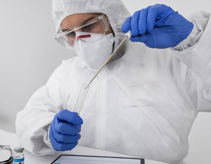 Healthcare worker in PPE performing lab test — rapid and molecular diagnostics at Marpeh Urgent Care in Niles, IL