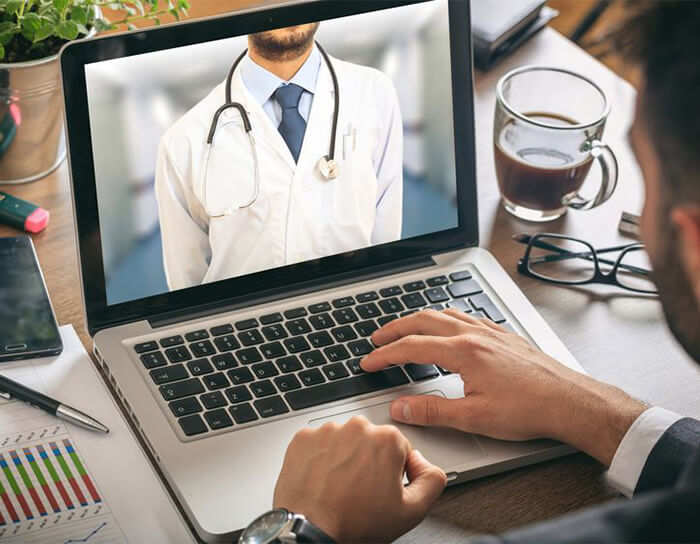 Telemedicine consultation via laptop – virtual urgent care services from CareCentrics Urgent Care in Niles, IL